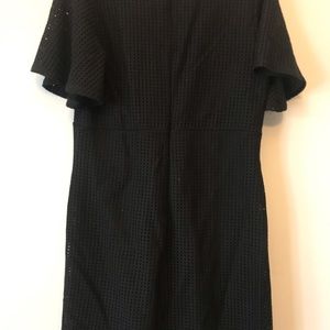 Black dress with angel sleeves. 33” in length. Cross cross tie in front.